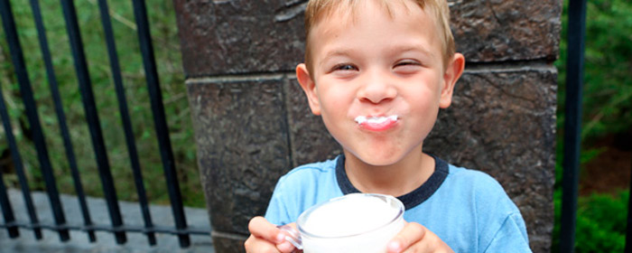 Little boy enjoying a glass of Butterbeer