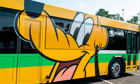 Disney has officially rolled out six new bus designs including Pluto, Mickey and Minnie (Photo: Disney Parks Blog)